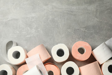 Toilet paper on grey background, space for text