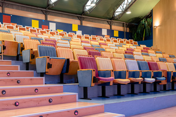 Example of brightly coloured auditorium or theatre fold-up seating