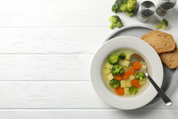 Soup on wooden background, top view. Healthy food