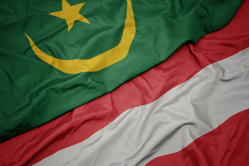 waving colorful flag of austria and national flag of mauritania.