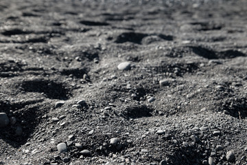 Black sand on a volcanic beach on the Canary Islands such as Tenerife