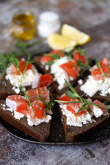 Plate with keto toast with salmon and white cheese.