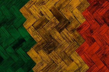 green yellow red reggae background on Wickerwork texture