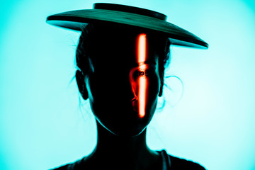 Futuristic portrait of young girl with hat