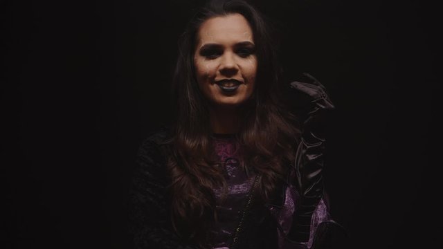 Attractive young woman dressed up like a witch