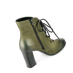 Stylish suede ankle boots isolated on white background.