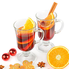 Mulled wine, orange, spices and gingerbread cookies isolated on a white background.