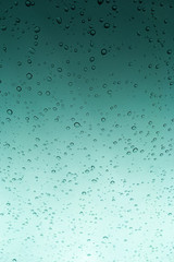 water drops on green gradient background vertical view