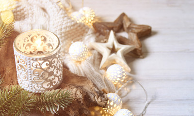 Cosy and soft winter background, knitted sweater and lights