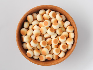Front view of little ball cookies isolated on white background.  Designed mouthpieces for children, which is melted into the mouth to make it easier for children to digest. Food concept.