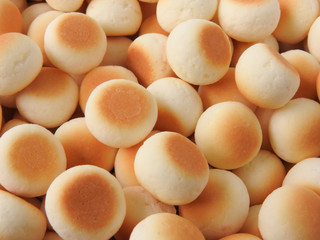 Top view of little ball cookies background. Designed mouthpieces for children, which is melted into the mouth to make it easier for children to digest. Food concept.