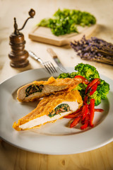 kiev chicken turkey with steamed broccoli and grilled pepper