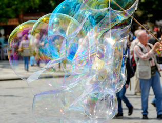 Giant soap bubbles of a street artist at Prague