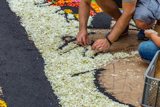 la Orotava, Tenerife, Spain - June 27, 2019. Beautiful flower carpets in La Orotava during Corpus Christi. Famous religious event and competition of folk art. Warm summer evening and joyful visitors