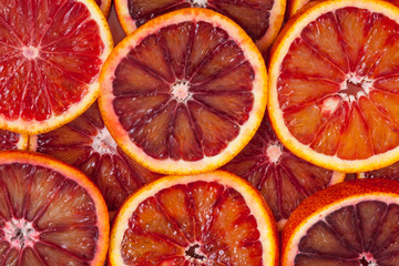 Red sicilian orange slices background