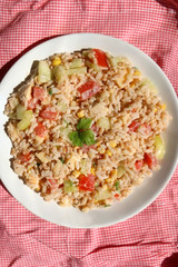 Salad with rice, chicken, cheese and vegetables. Top view.