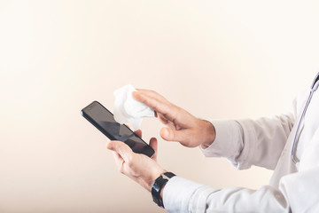 Man cleaning cell phone. Health prevention by virus