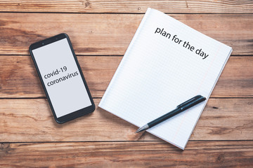 plan for the day text on notepad on keyboard