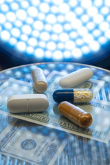 Color medicine pills on blue laboratory table