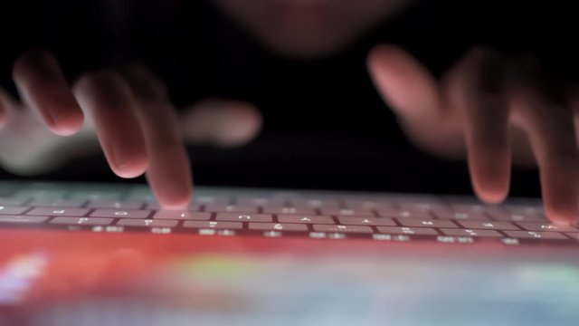 Close up of Child finger typing keyboard on tablet pc