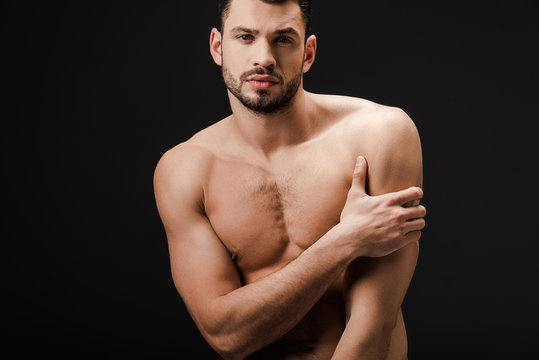 handsome sexy naked man isolated on black