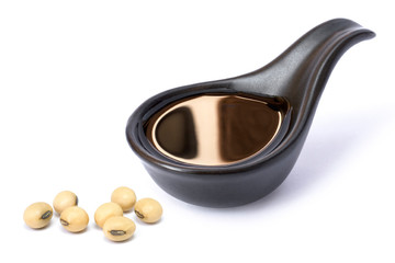 soy sauce with soy beans isolated on white background.