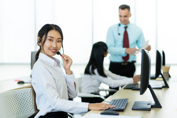 Helpdesk and telemarketing sales representative team in working.