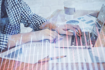 Multi exposure of stock market chart with man working on computer on background. Concept of financial analysis.