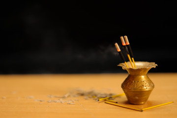 Handmade reed refreshment on wooden table in living room, close up