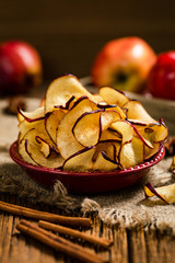 Baked Cinnamon Red Apple Chips. Selective focus.