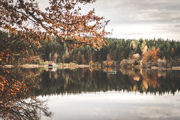autumnal hut by the lake