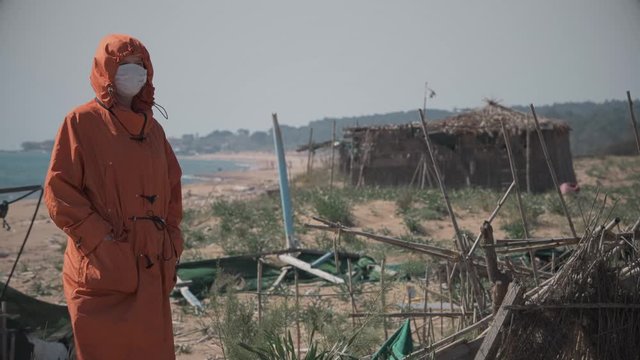Lonely girl on the beach during coronavirus quarantine in Greece