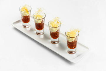 Sweet snacks in glass on white background. Catering service