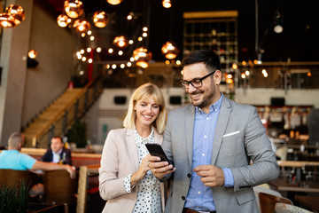 Business people having fun and chatting at workplace office