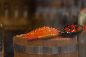 Red salted caviar with wooden spoon. Red salted caviar. Red caviar.