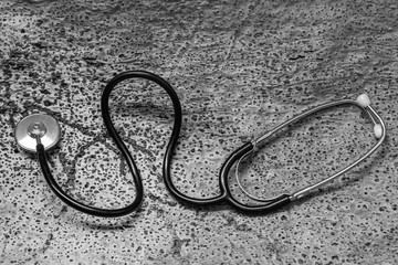 Medical stethoscope on cork tree background. Saving nature and humanity
