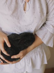  black rabbit hands in girl
