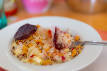 delicious salad on a fork with  kohlrabi, beetroot, lentils and cereals