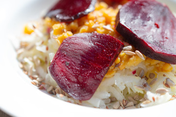 delicious salad on a white plate  with kohlrabi, beetroot, lentils and grains
