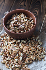 Walnuts on dark wooden background