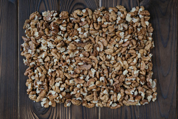 Walnuts on dark wooden background