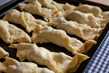 step by step cooking croissants with cherries. Baked in oven.