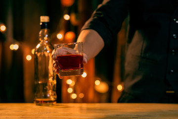 Barman pouring whiskey whiskey glass beautiful night