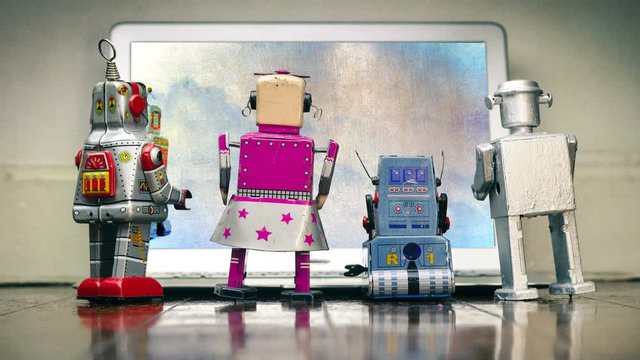 cinemagraph four robots watching a frantic  dont panic bot on a laptop 