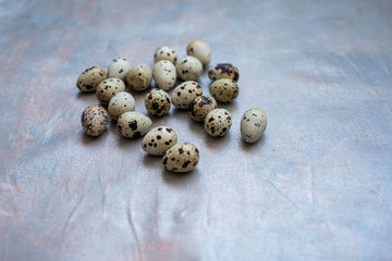Lots of quail eggs on a light background
