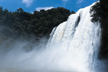 Traveler sightseeing landmark of Huangguoshu Waterfall, the largest waterfalls in China and East Asia at Baishui River in Anshun, Guizhou province, China.