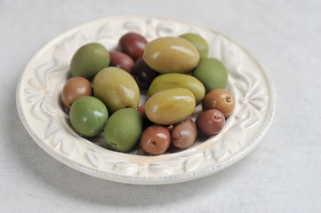 olives of different varieties in a plate
