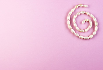 pearl jewelry on a purple background
