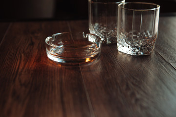 empty glasses for whisky and ash-tray