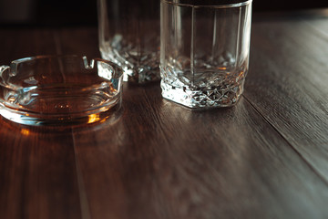 empty glasses for whisky and ash-tray
